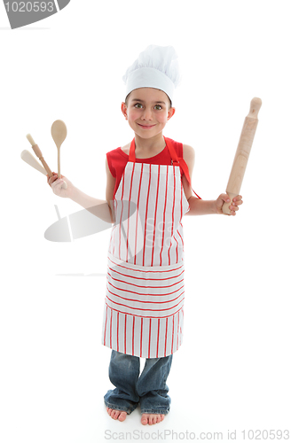 Image of Little chef holding kitchen utensils