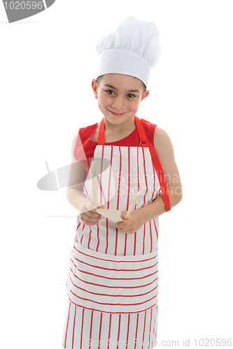 Image of Smiling chef holding kitchen utensils