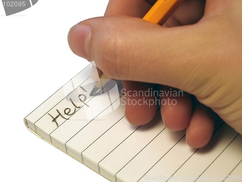 Image of Notebook, someone writing 'Help!'