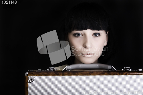 Image of A girl with suitcase   