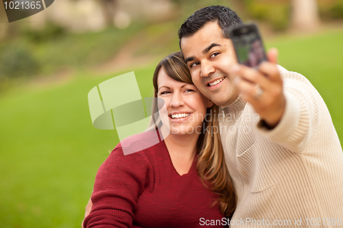 Image of Attractive Mixed Race Couple Taking Self Portraits