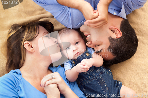 Image of Mixed Race Family Playing on the Blanket