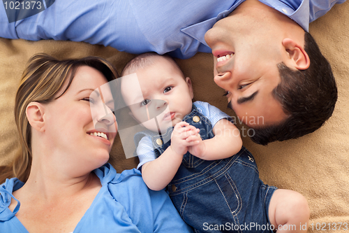 Image of Mixed Race Family Playing on the Blanket