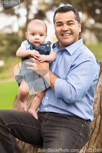 Image of Handsome Hispanic Father and Son Posing for A Portrait