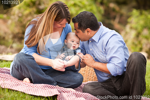 Image of Happy Mixed Race Family Playing In The Park