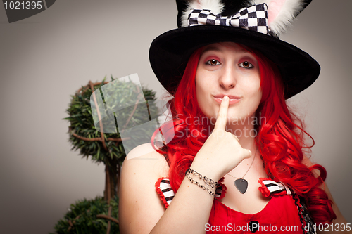 Image of Attractive Red Haired Woman Wearing Bunny Ear Hat