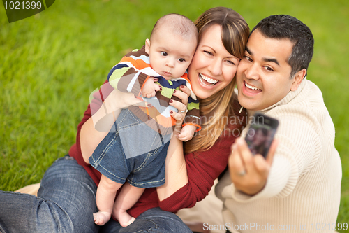 Image of Happy Mixed Race Parents and Baby Boy Taking Self Portraits
