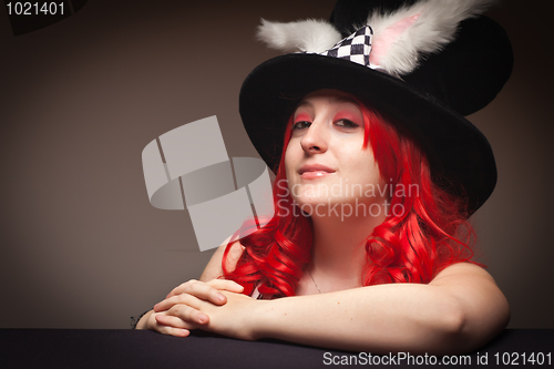 Image of Attractive Red Haired Woman Wearing Bunny Ear Hat