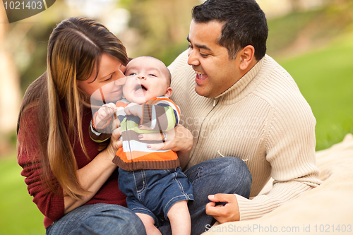 Image of Happy Mixed Race Parents Playing with Their Son