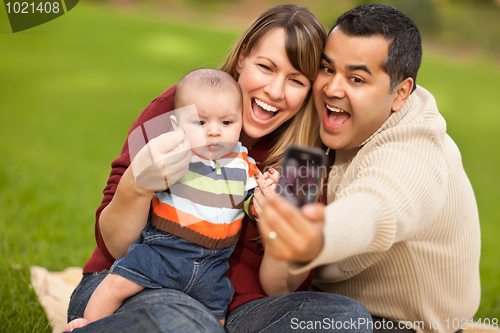 Image of Happy Mixed Race Parents and Baby Boy Taking Self Portraits
