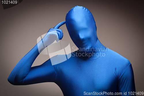 Image of Man Wearing Full Blue Nylon Bodysuite Scratching Head