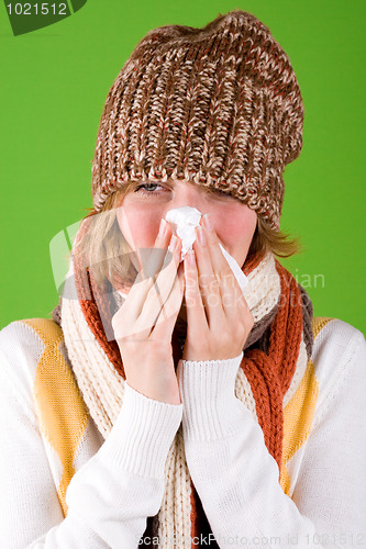 Image of sneezing woman with handkerchief 