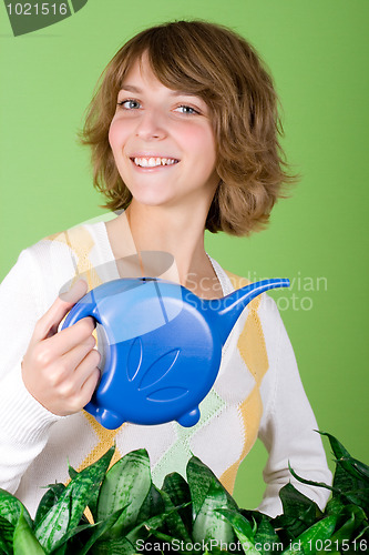 Image of girl watering flowers