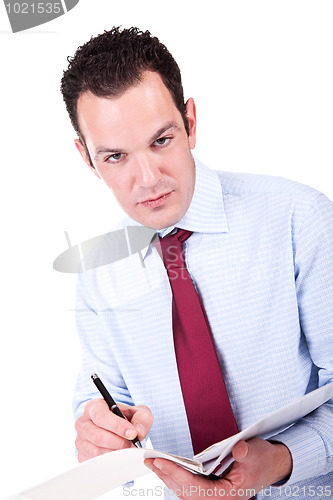 Image of Young Business Man, writing 