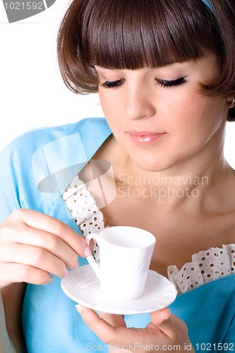 Image of woman enjoying a cup of coffee