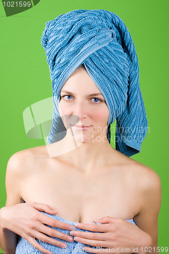 Image of young woman in blue towel