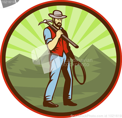 Image of Miner carrying pick ax