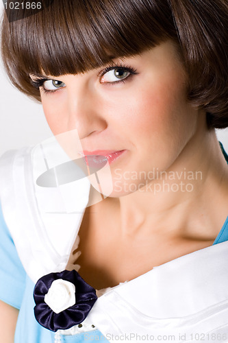 Image of brunet woman in blue dress 