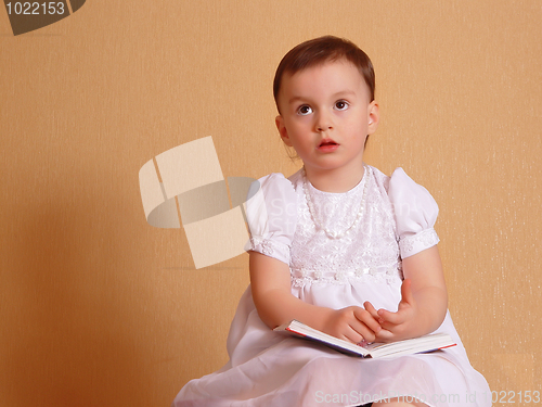 Image of Girl dreaming in a white dress