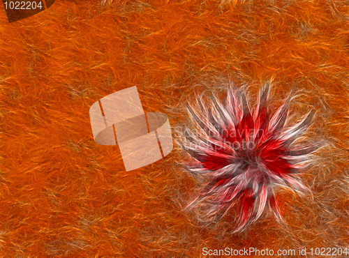 Image of abstract knitted red flower at orange background