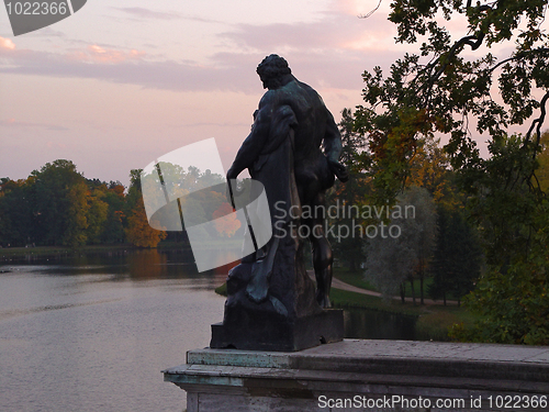 Image of Hercules statue in autumn evening park