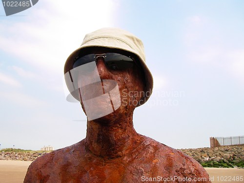 Image of life-size statue on the beach