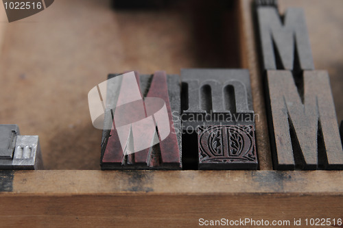 Image of letterpress M close up