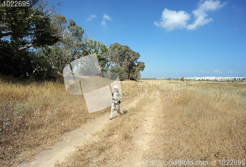 Image of The boy on the road