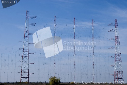 Image of a row of electricity pylons