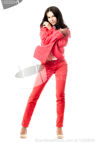 Image of Sexy playful young brunette in red suit. Isolated 