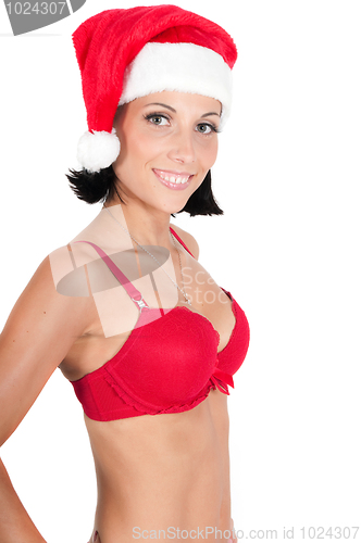 Image of Portrait of beautiful woman in red santa hat
