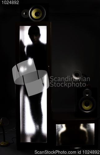 Image of A girl behind the glass door           