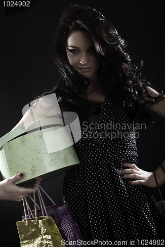 Image of Young girl with shopping bags 