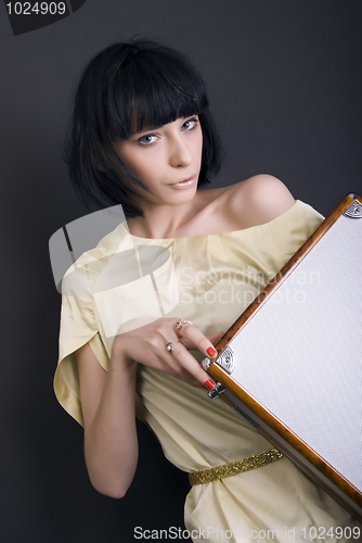 Image of A girl with suitcase   