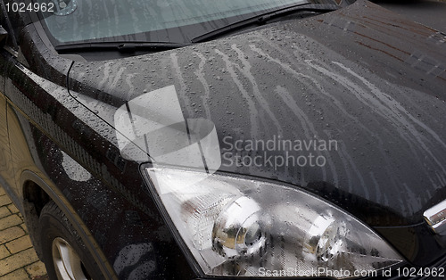 Image of Black car with rain drops