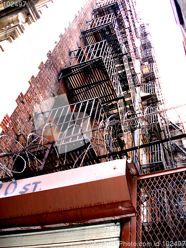 Image of NYC building with barbed wire