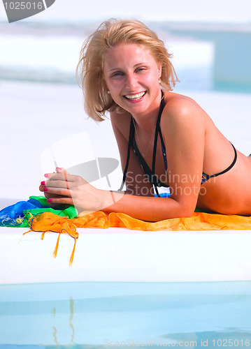 Image of Young woman in the pool 