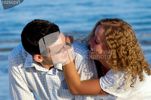Image of Happy young couple at beach