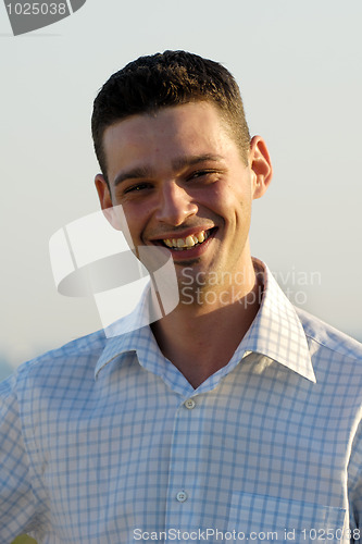 Image of Young man smiling