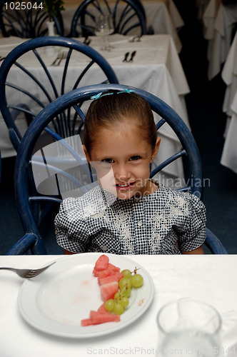 Image of child at restaurant table