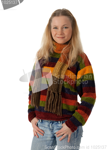 Image of Young woman wearing a sweater holding hands in pockets