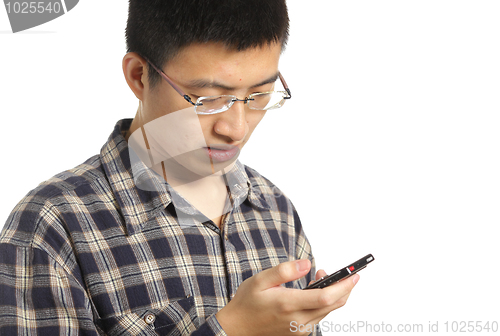Image of business man reading an SMS on cellphone against white