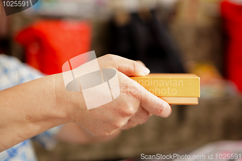 Image of gift box on hand