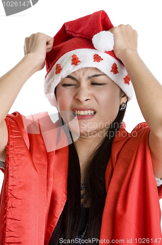 Image of disappointed woman with santa claus hat