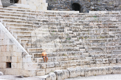 Image of The woman in the ancient Roman amphitheater 