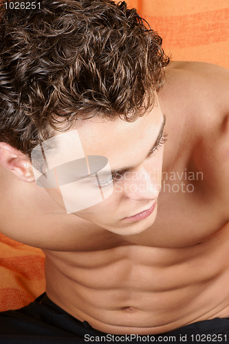 Image of Portrait of a young man over orange