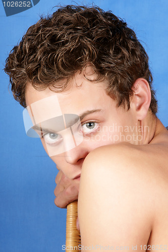 Image of Young man portrait over blue