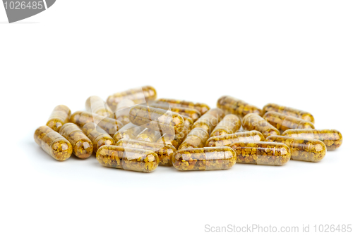 Image of Pile of homeopathic pills with bee pollen