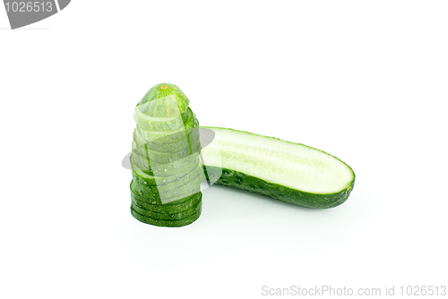 Image of Half of cucumber and pile of slices