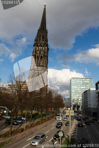 Image of Nikolaj Kirche (War Memorial) and cars on a street in Hamburg, Germany